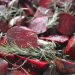 Roasted beet slices with fresh rosemary sprigs.