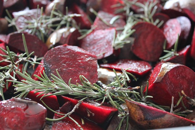 Roasted beet slices with fresh rosemary sprigs.