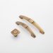 Bronze cabinet handles and knob displayed on white background.