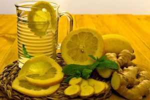 Refreshing lemon ginger tea with fresh slices and mint.
