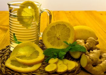 Refreshing lemon ginger tea with fresh slices and mint.