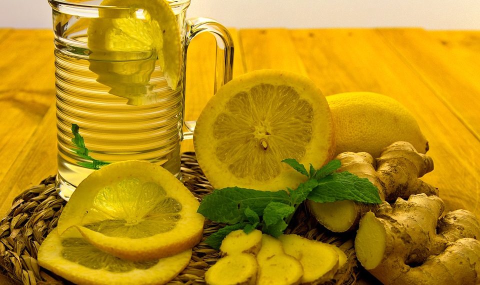 Refreshing lemon ginger tea with fresh slices and mint.
