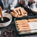 Tiramisu ingredients ready for assembly with coffee and ladyfingers.