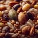 Assorted grains and seeds in a close-up, showcasing natural textures.