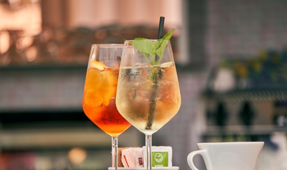 Refreshing cocktails with mint garnish served outdoors.