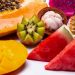 Tropical fruit assortment with kiwi, watermelon, and papaya.