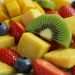 Tropical fruit salad with kiwi, strawberries, blueberries, and pineapple cubes.