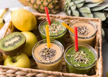Smoothies with seeds and fresh fruit in a basket