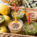 Smoothies with seeds and fresh fruit in a basket