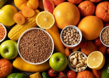 Assorted fruits, nuts, and grains create a colorful, healthy mix.