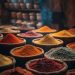Baskets of colorful spices in a market stall.