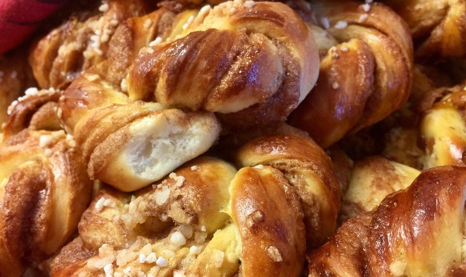 Sweet braided cinnamon buns with sugar topping.