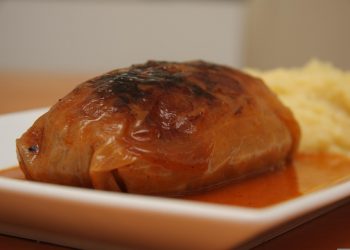 Stuffed cabbage roll served with mashed potatoes.