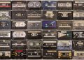 Vintage cassette tapes organized in rows, showcasing various brands and styles.