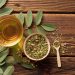 Herbal tea with yerba mate leaves on rustic wooden table.