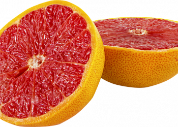 Half pink grapefruit with juicy flesh.