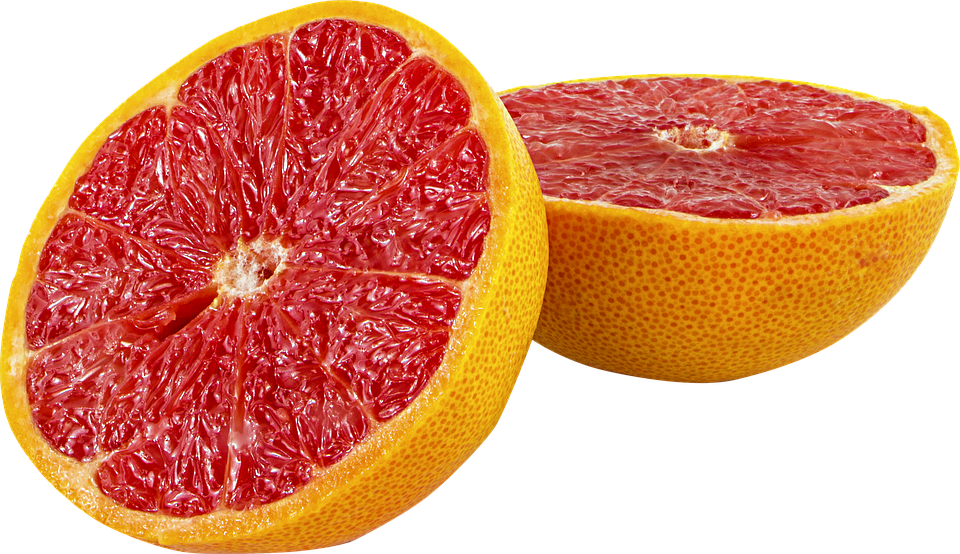Half pink grapefruit with juicy flesh.