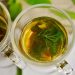 Herbal tea with fresh mint and fennel leaves in glass cups.