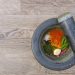 Mortar and pestle with colorful spices and herbs.