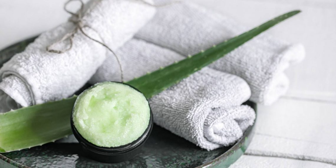 Aloe scrub with towels on spa tray