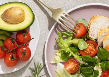 Avocado, tomatoes, and salad with grilled chicken.