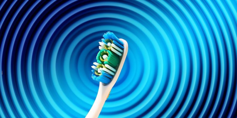 Toothbrush with blue and green bristles on abstract blue spiral background.