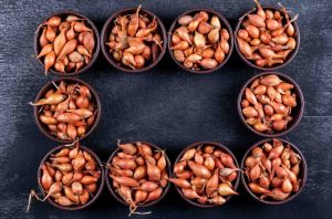 A set of onions or small shallots in bowls in rectangular form top view
