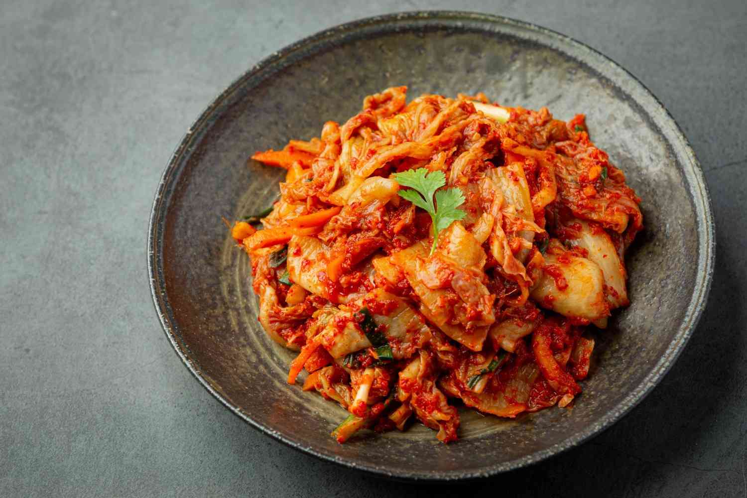 Kimchi ready to eat in black plate