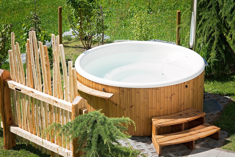 Wooden hot tub in garden setting