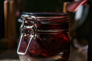 a jar filled with liquid sitting on top of a table