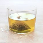 clear drinking glass with yellow liquid