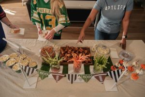 Football themed party food spread with snacks