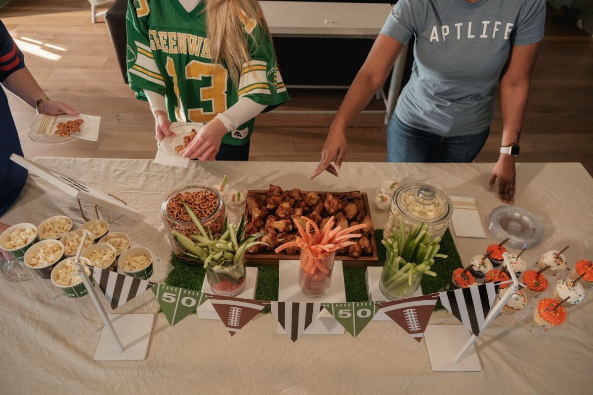 Football themed party food spread with snacks