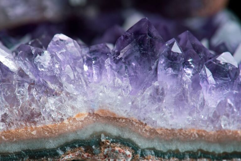 Close-up of beautiful amethyst crystal formations showcasing their vibrant purple hues in stunning detail.